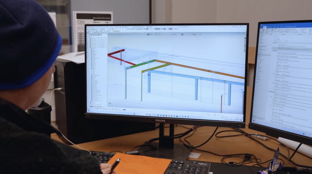 man on computer using AI